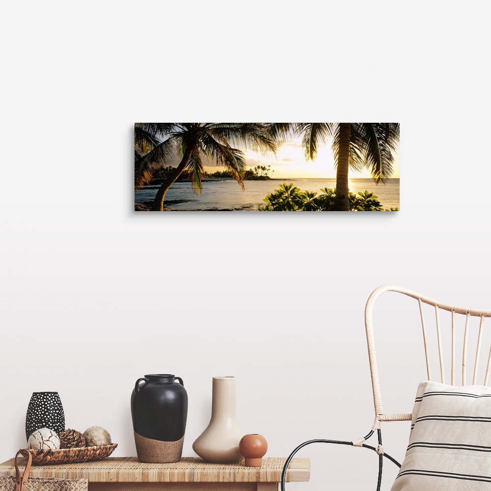 A farmhouse room featuring Panoramic wall art photo for the office or home of the Hawaiian coast; palm trees frame the sun s...