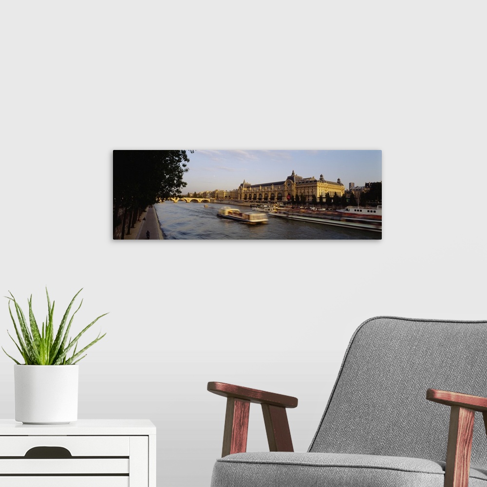 A modern room featuring Passenger craft in a river, Seine River, Musee D'Orsay, Paris, France