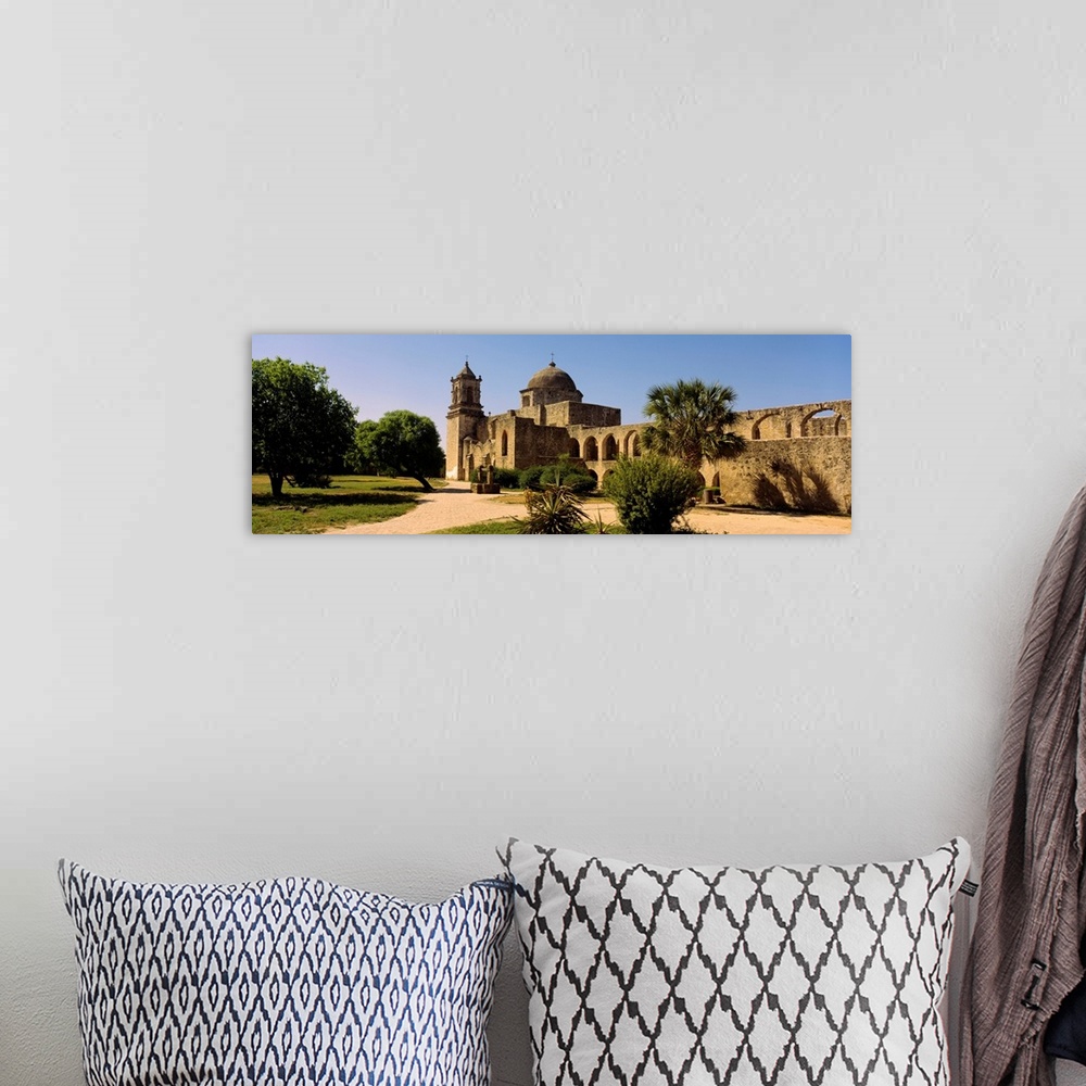 A bohemian room featuring Panoramic photograph of a brick path leading toward the historic Mission San Jose, surrounding by...