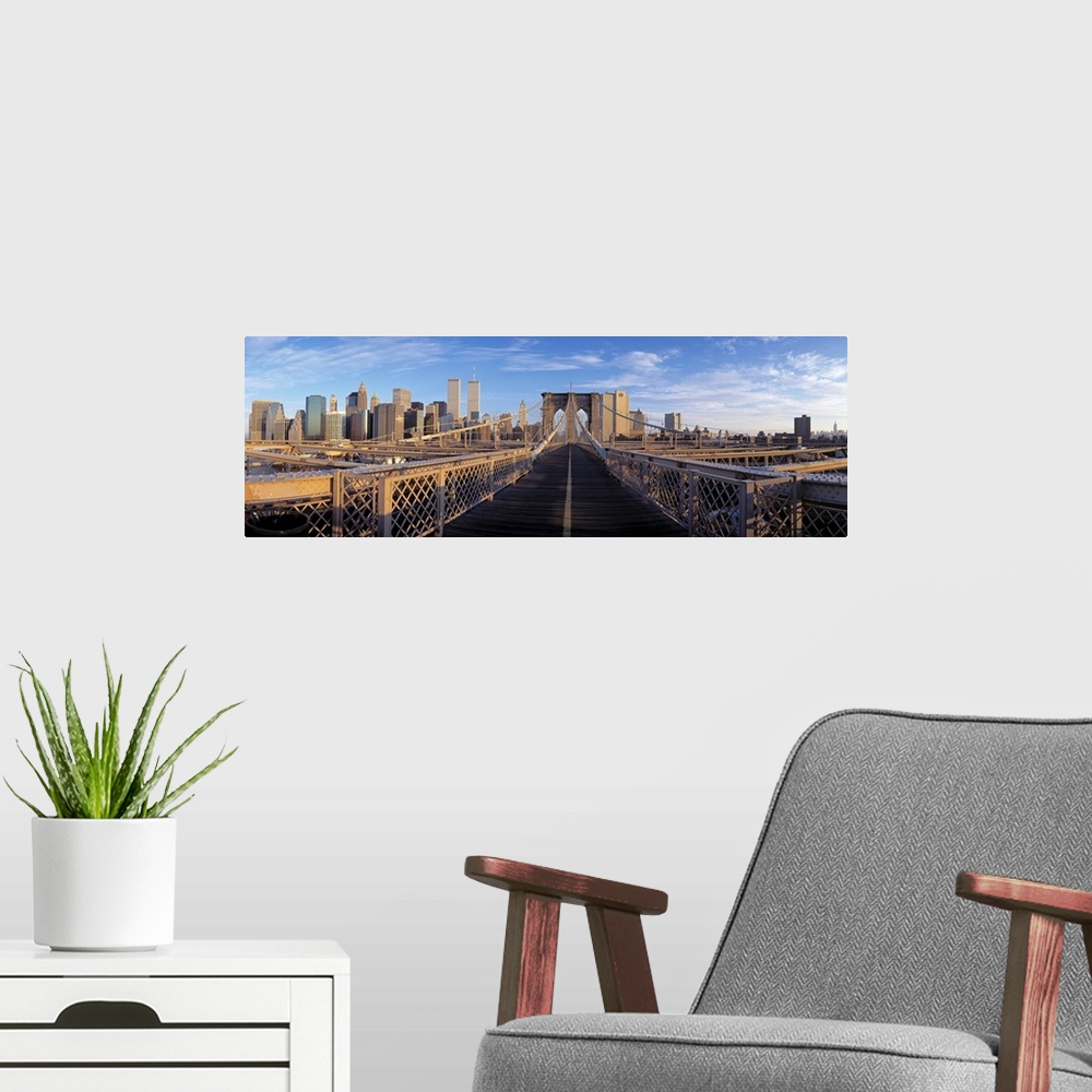 A modern room featuring Panoramic view from the Brooklyn Bridge of walk into Manhattan with skyscrapers in the background.