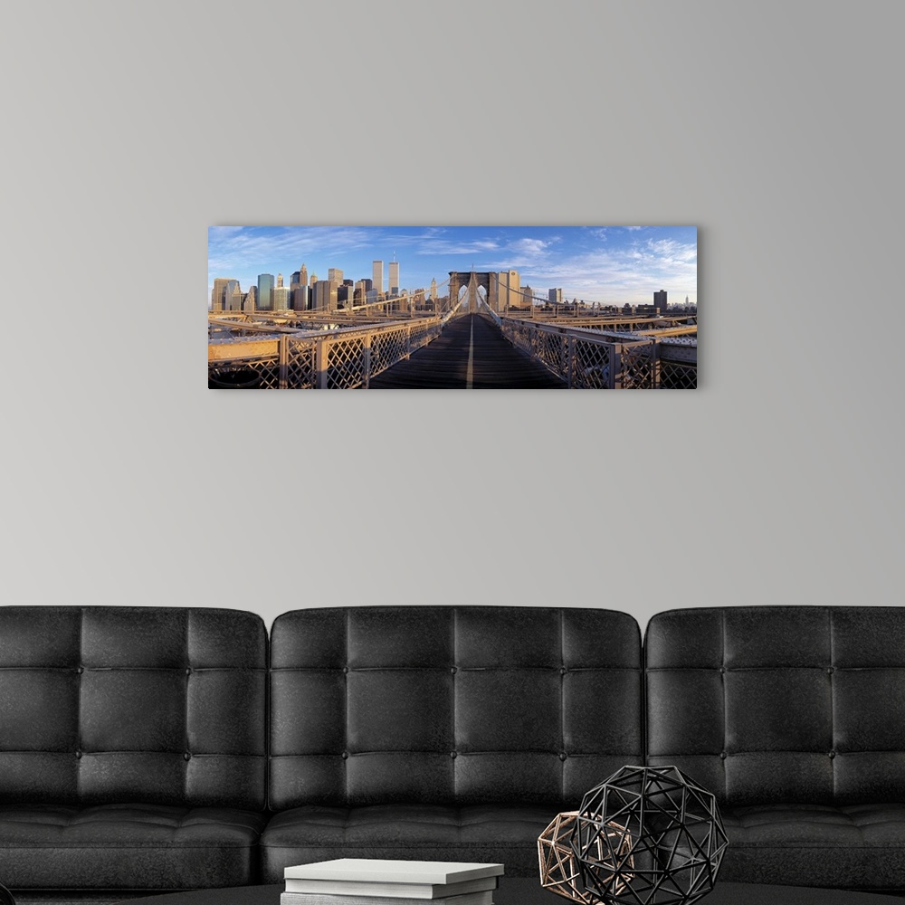 A modern room featuring Panoramic view from the Brooklyn Bridge of walk into Manhattan with skyscrapers in the background.