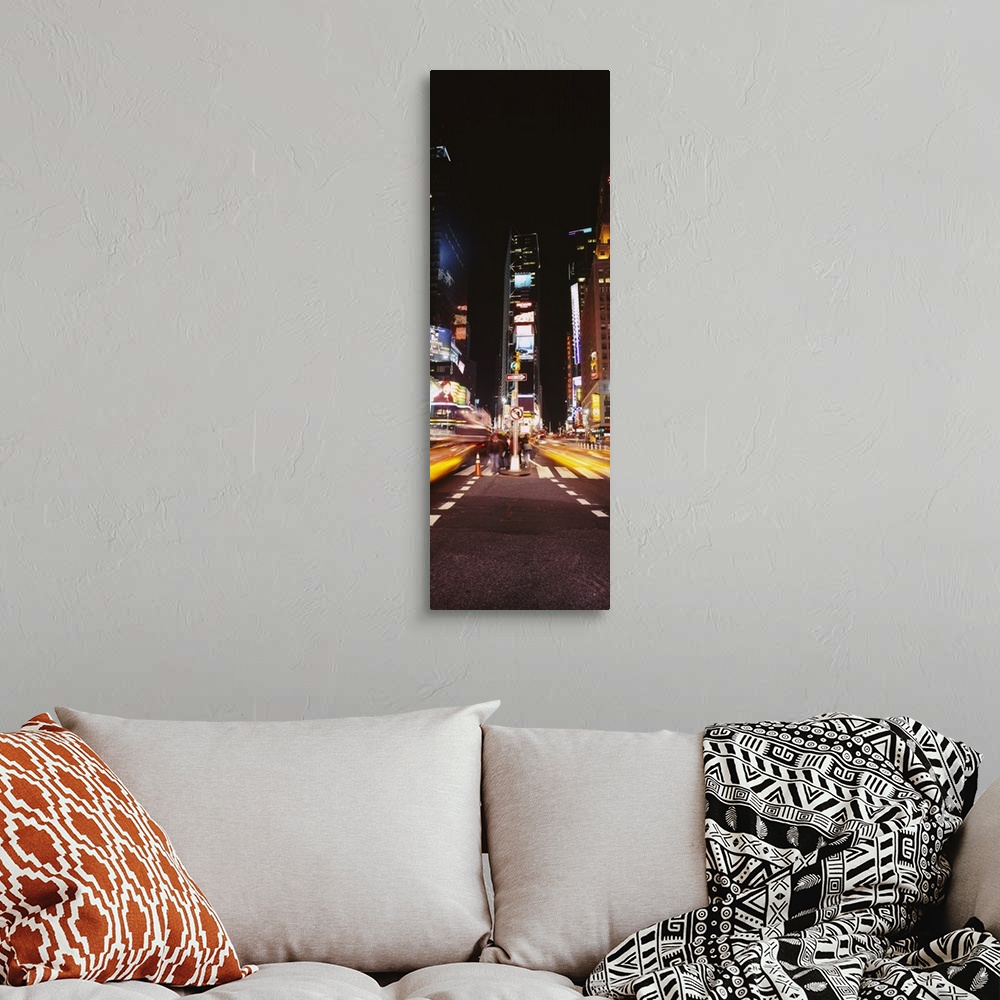 A bohemian room featuring This vertical time lapsed photograph shows the blur of motion created by cars driving through Tim...