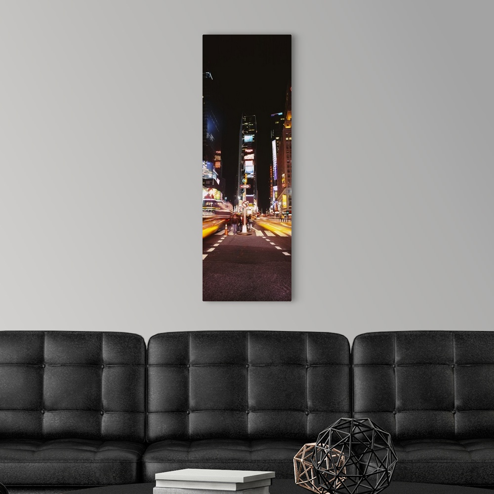 A modern room featuring This vertical time lapsed photograph shows the blur of motion created by cars driving through Tim...
