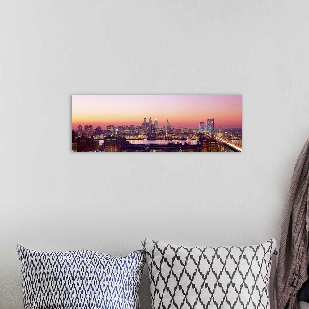 A bohemian room featuring Panoramic photograph displays the busy skyline and Benjamin Franklin bridge in Philadelphia, Penn...