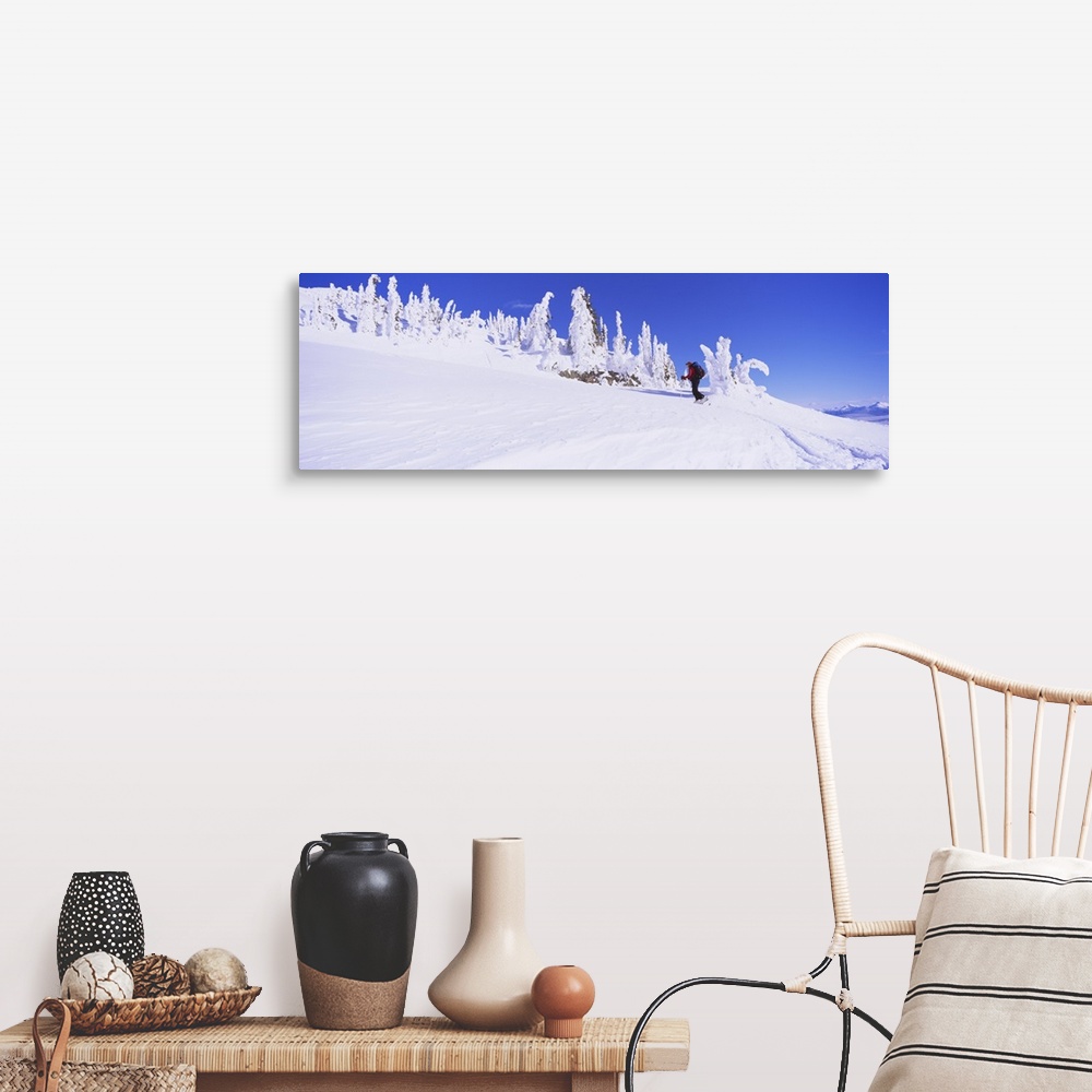A farmhouse room featuring Person skiing on a snow covered landscape, Monashee Mountains, British Columbia, Canada
