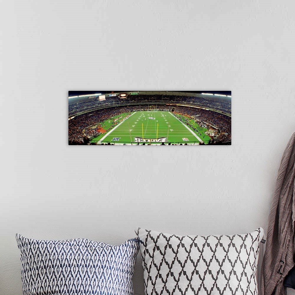 A bohemian room featuring Panoramic photograph taken above an end zone of a National Football League team's field located w...