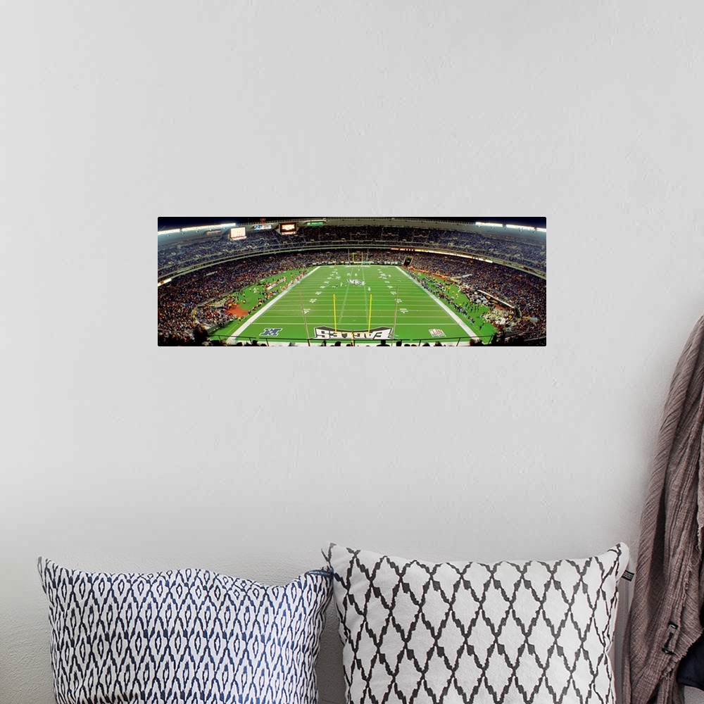 A bohemian room featuring Panoramic photograph taken above an end zone of a National Football League team's field located w...
