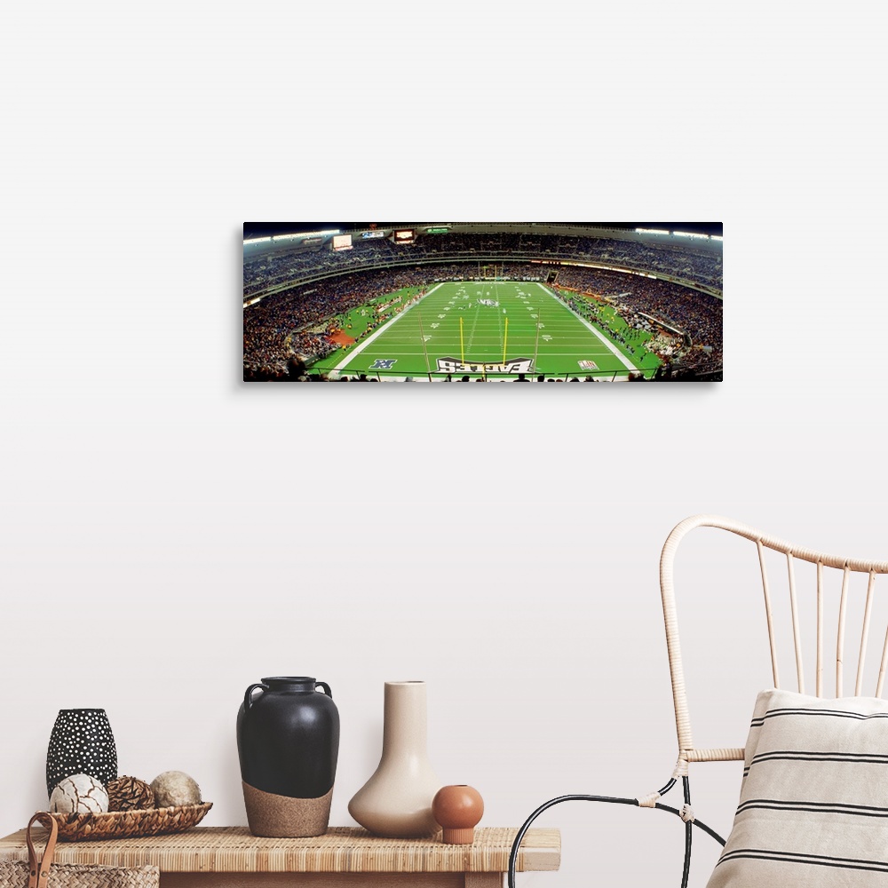 A farmhouse room featuring Panoramic photograph taken above an end zone of a National Football League team's field located w...