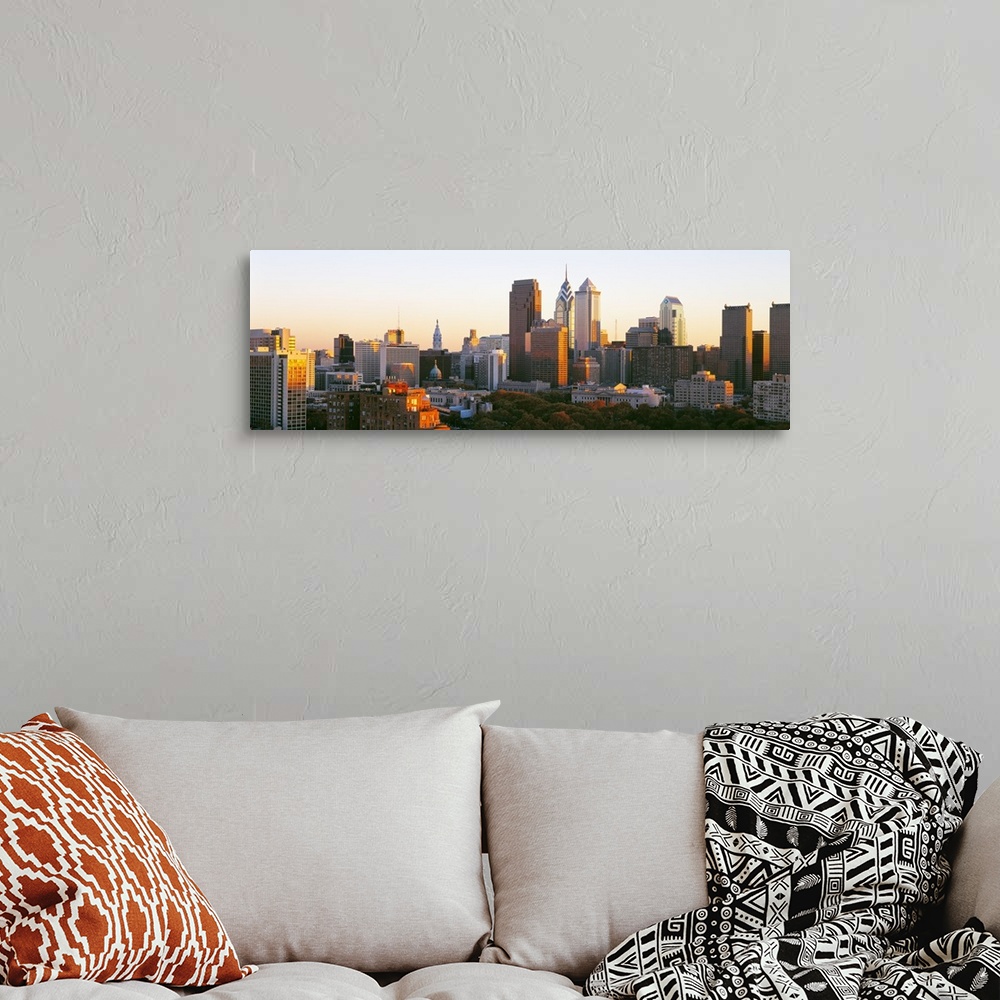 A bohemian room featuring Giant, panoramic photograph of the sun shining on the skyline of Philadelphia.
