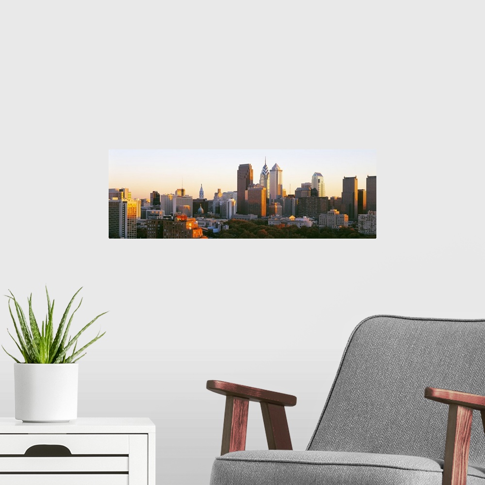 A modern room featuring Giant, panoramic photograph of the sun shining on the skyline of Philadelphia.