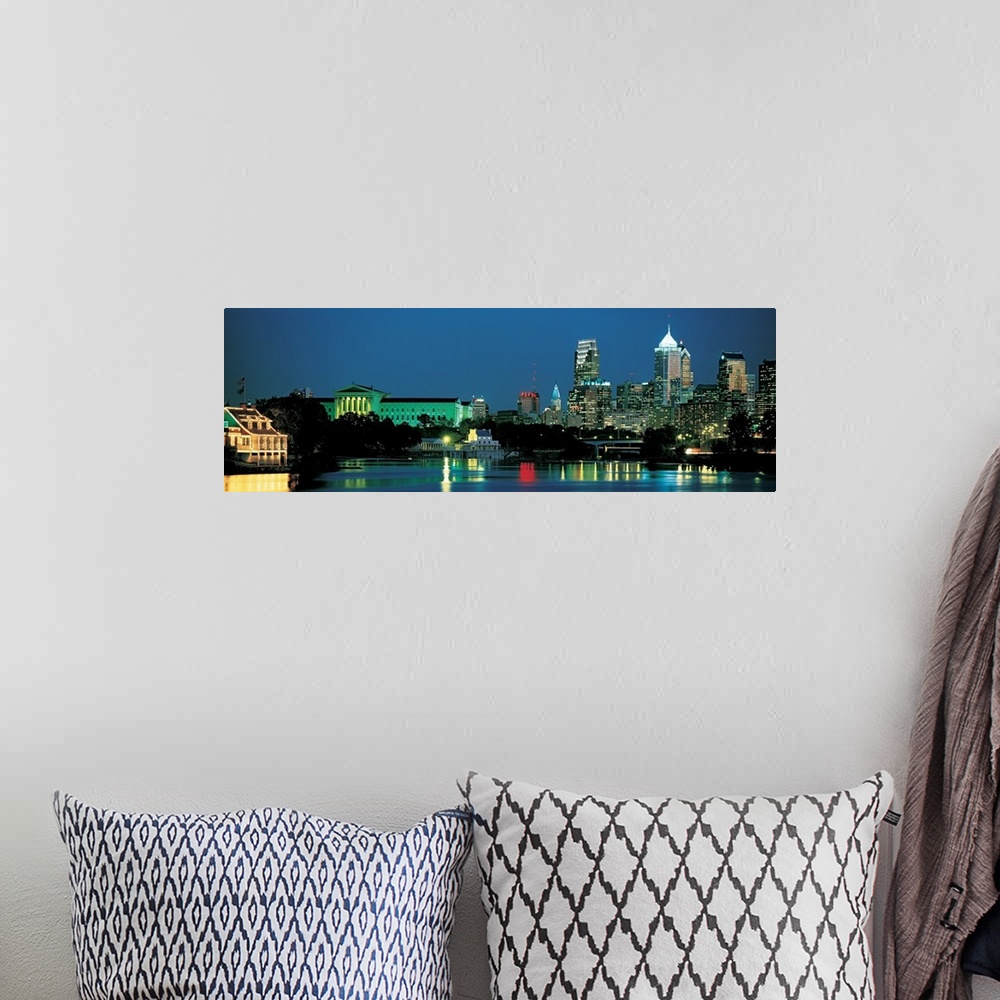 A bohemian room featuring Panoramic photograph of the Philadelphia, Pennsylvania skyline taken at night.  The bright lights...