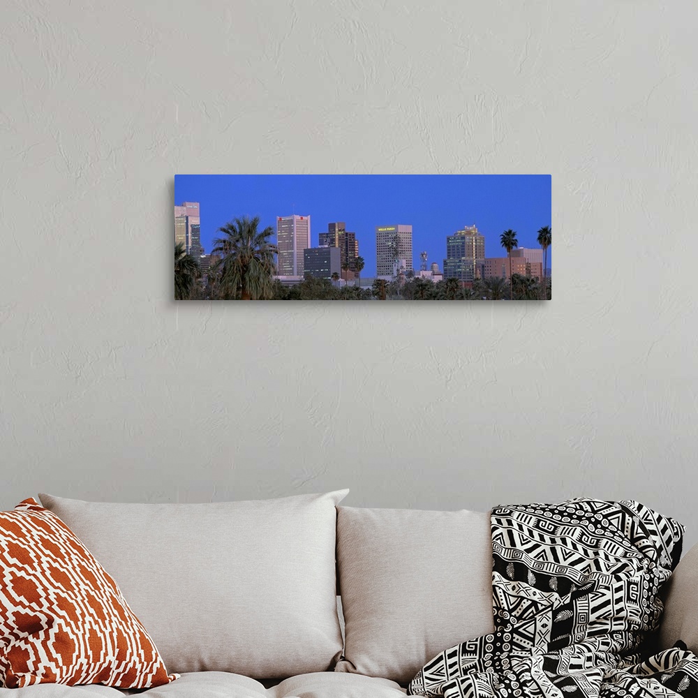 A bohemian room featuring Phoenix, Arizona palm trees and cityscape in a panoramic view.