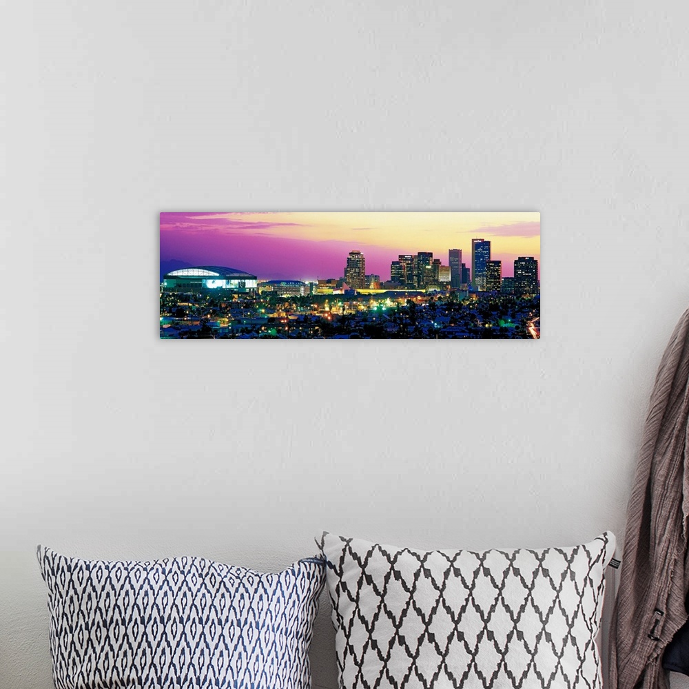 A bohemian room featuring Panoramic photograph displays the colorful skyline within the capital of Arizona as it brightly s...