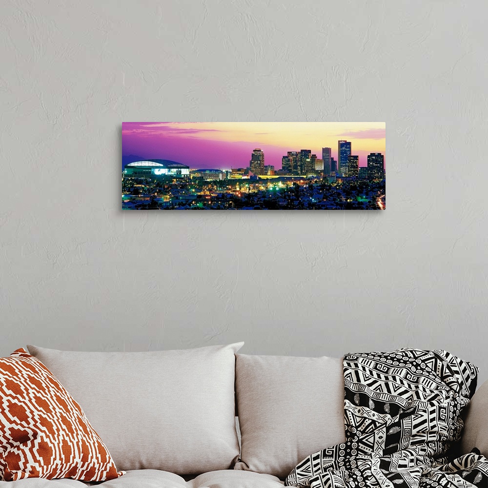A bohemian room featuring Panoramic photograph displays the colorful skyline within the capital of Arizona as it brightly s...