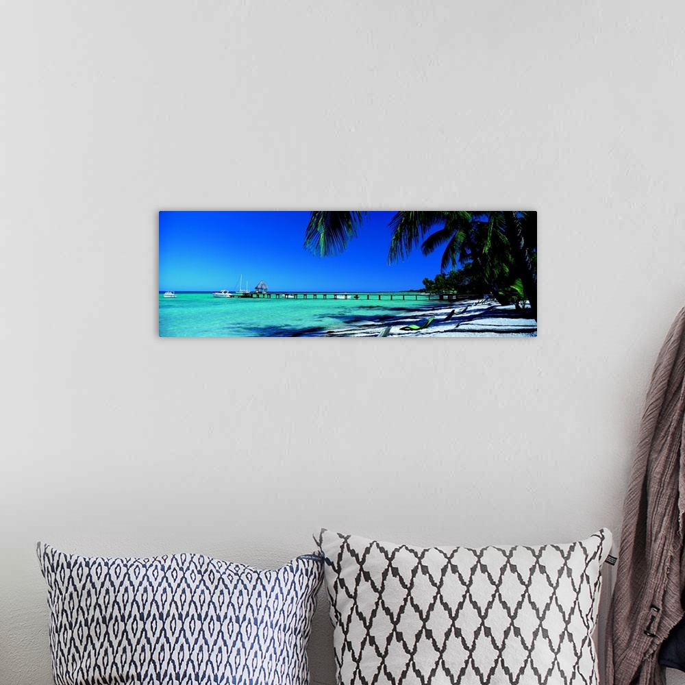 A bohemian room featuring Pier Beach Langiloa French Polynesia
