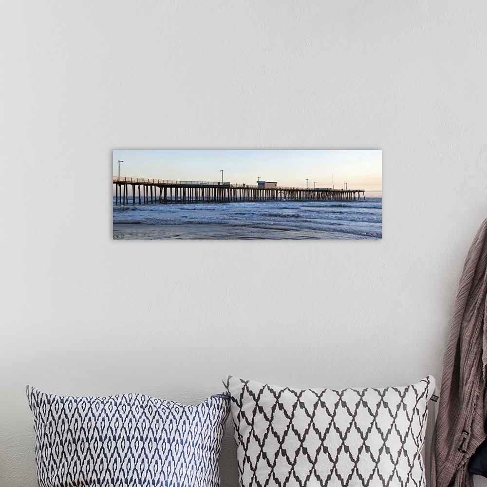 A bohemian room featuring Large landscape photograph of Pismo Beach Pier extending into the waters along Pismo Beach, in Sa...