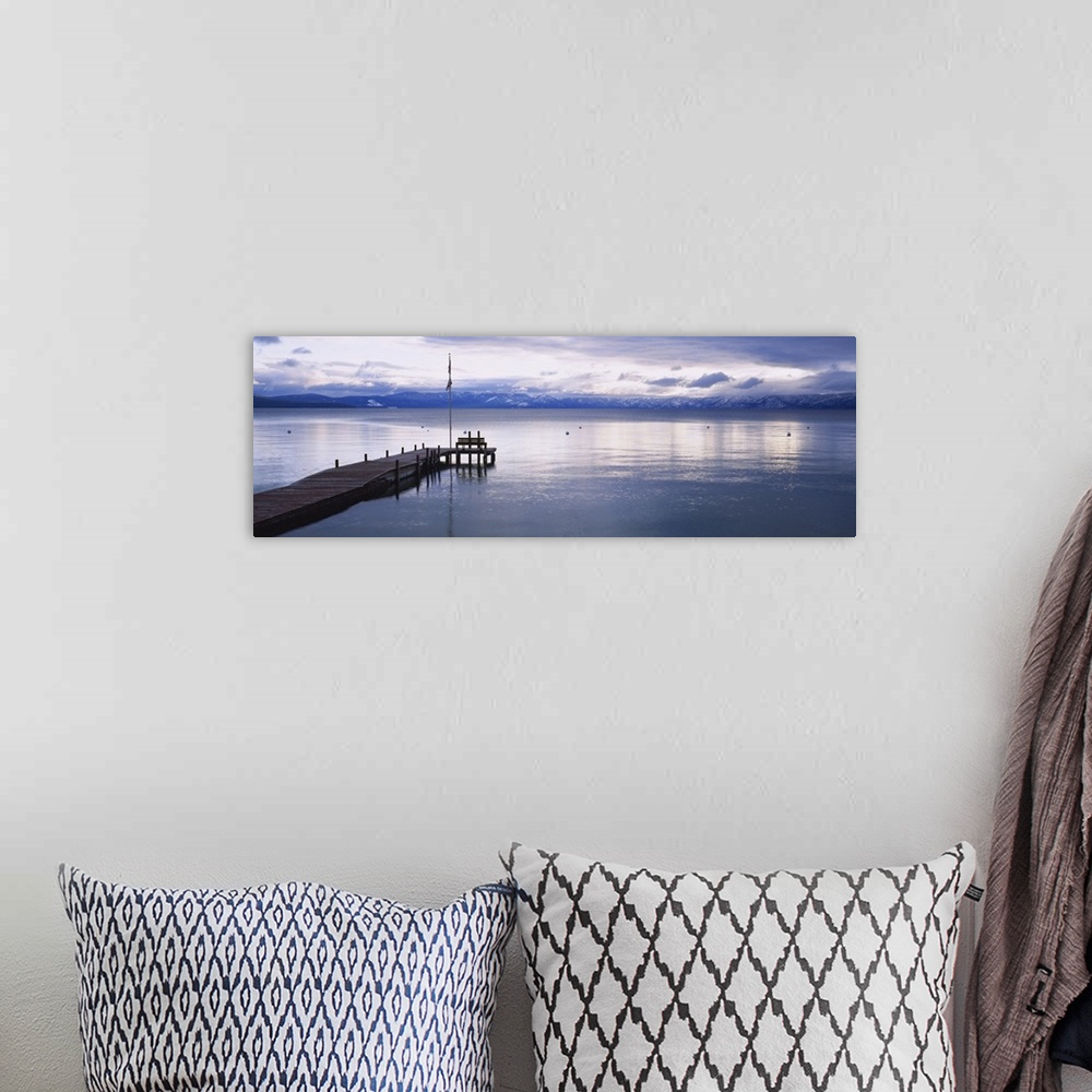 A bohemian room featuring Large dock on Lake Tahoe in California with mountains in the background.