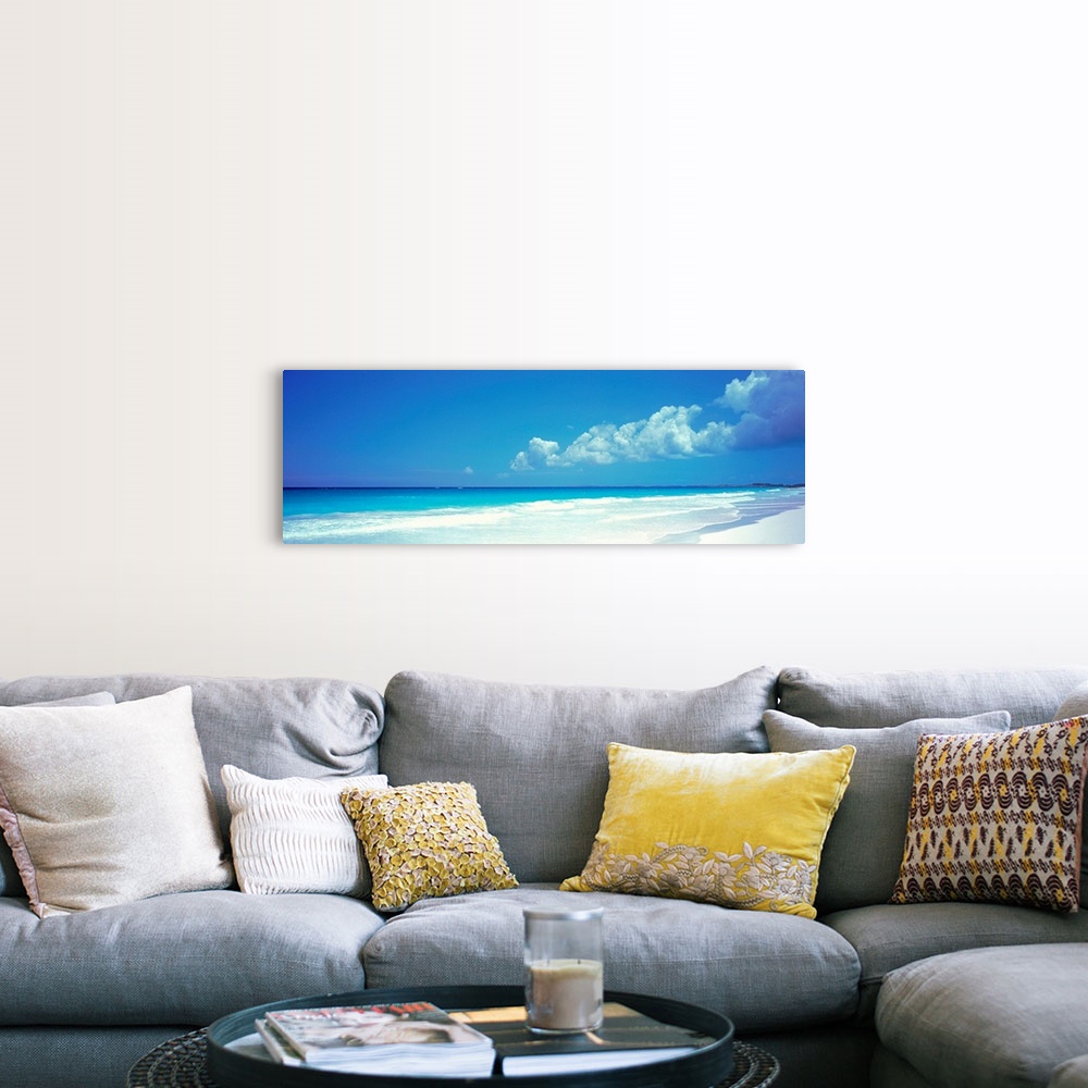 A farmhouse room featuring Panoramic photograph includes a near cloudless sky overlooking a sandy beach as the waves from th...