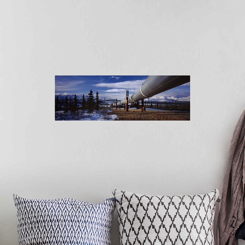 A bohemian room featuring Pipeline passing through a snow covered landscape, Trans-Alaskan Pipeline, Alaska