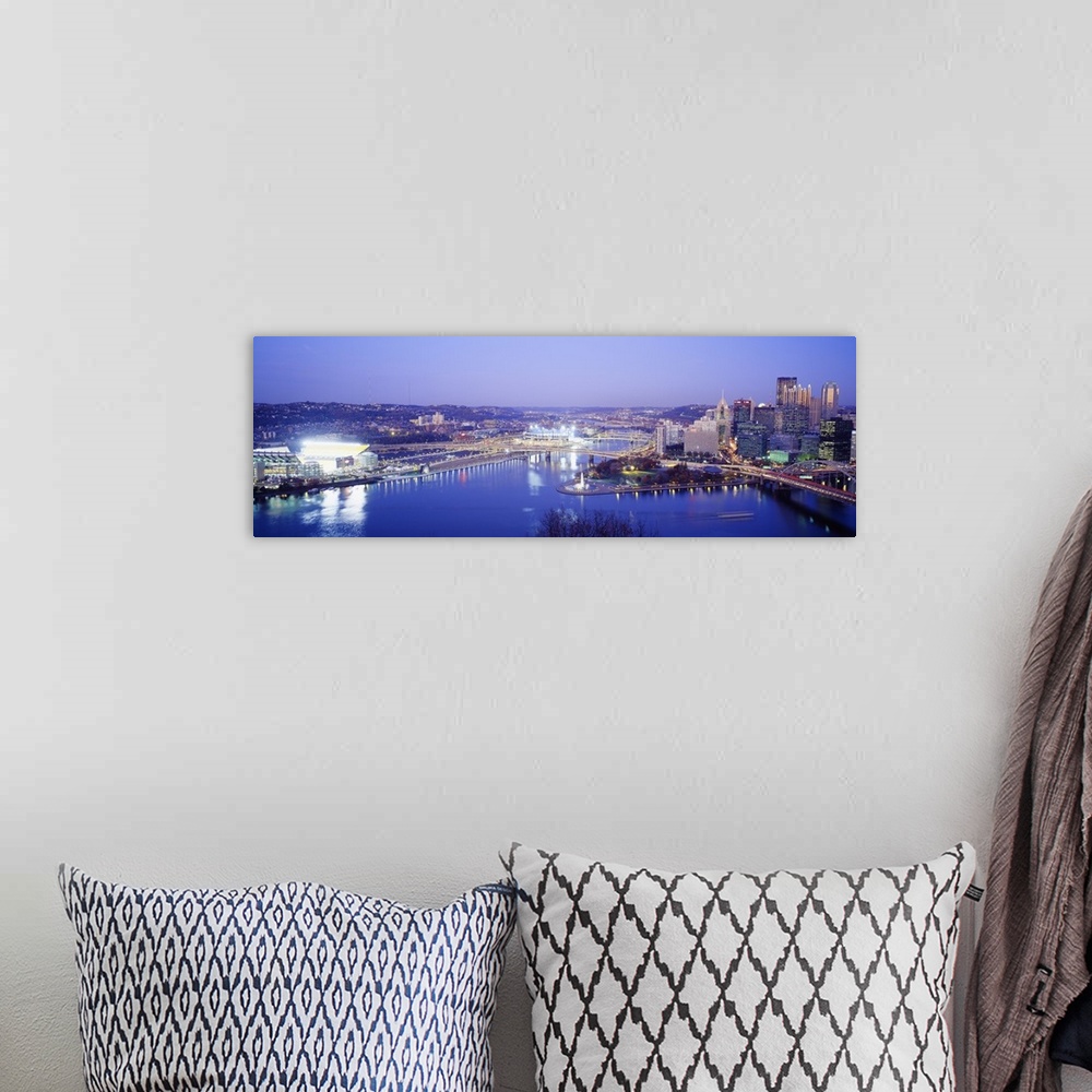 A bohemian room featuring Panoramic photograph displays an aerial view overlooking the busy skyline of a city within the No...
