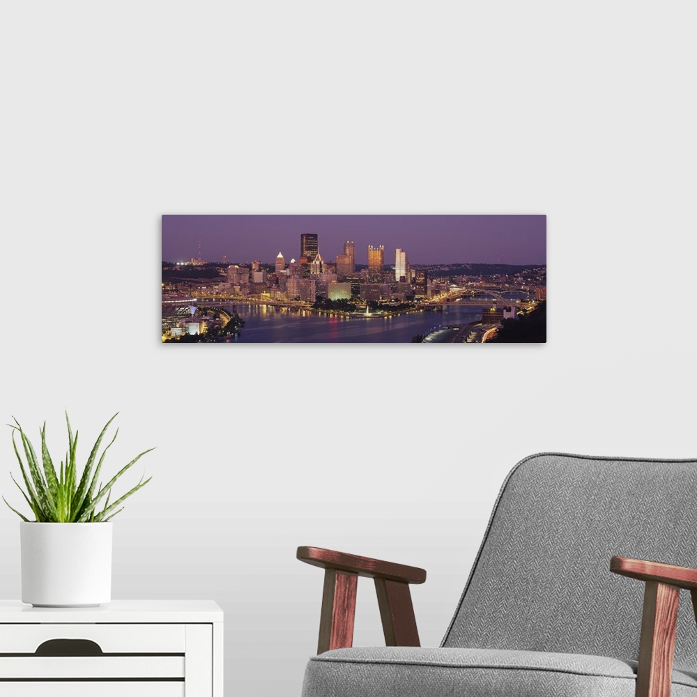 A modern room featuring This oversized wall art is a panoramic photograph of the cityos downtown captured from the south ...