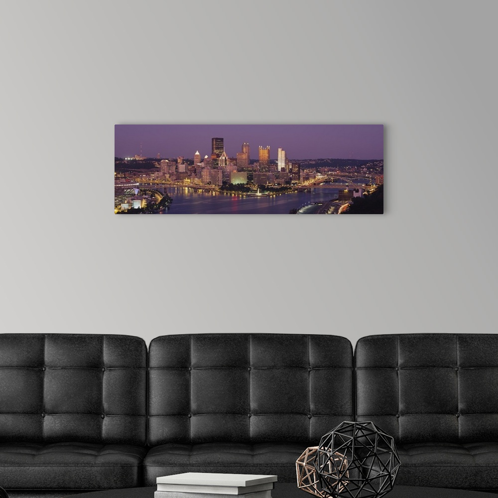 A modern room featuring This oversized wall art is a panoramic photograph of the cityos downtown captured from the south ...
