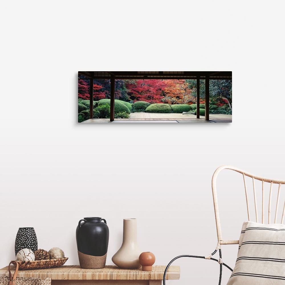 A farmhouse room featuring This panoramic photograph is taken from inside a temple and looking out into a forest filled with...