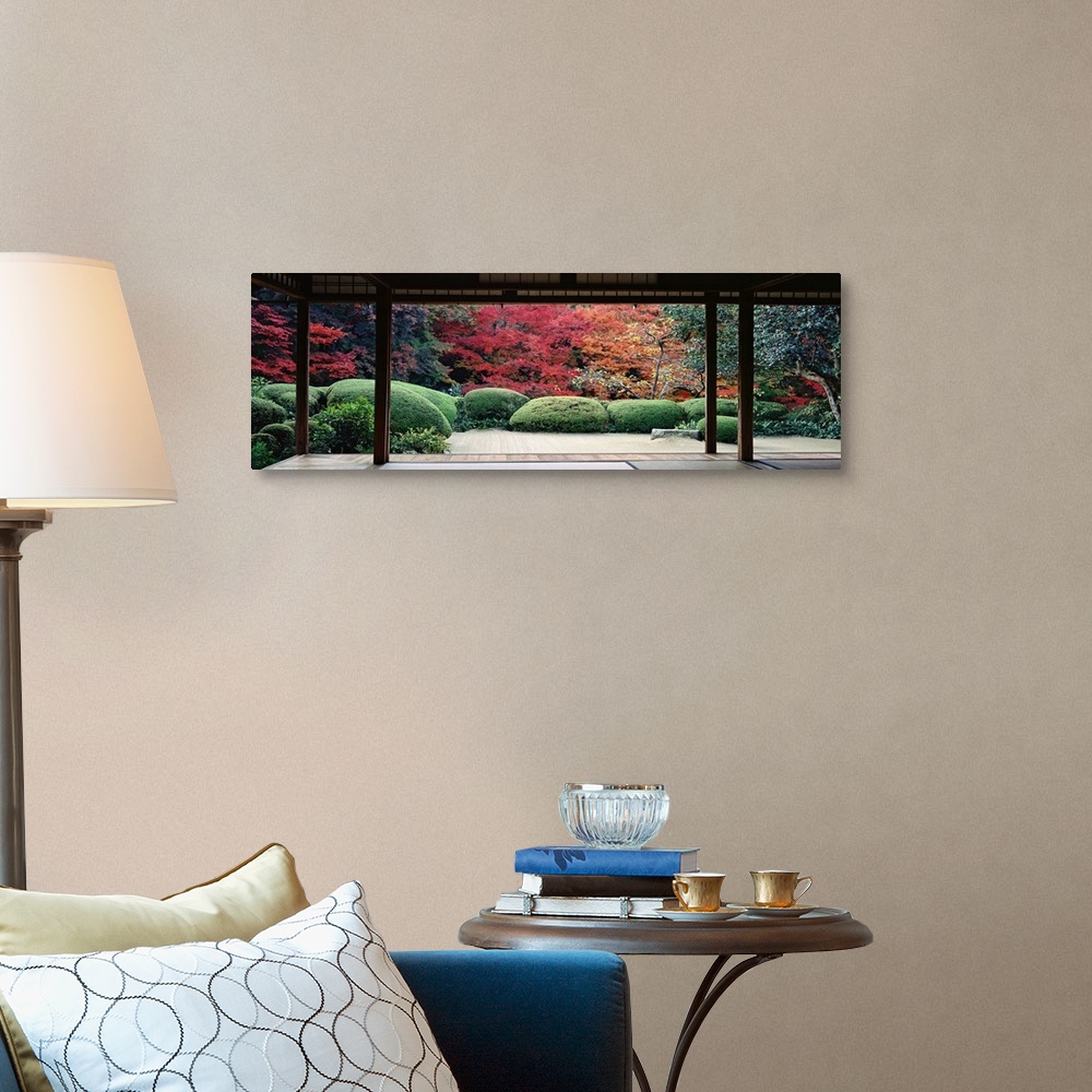 A traditional room featuring This panoramic photograph is taken from inside a temple and looking out into a forest filled with...