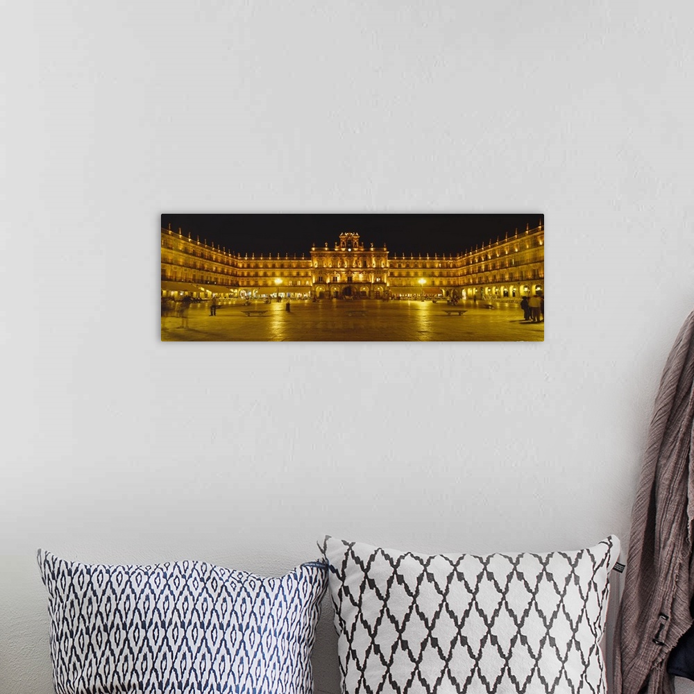 A bohemian room featuring Wide angle photograph on a large wall hanging of Plaza Mayor Castile & Leon Salamanca, lit up at ...