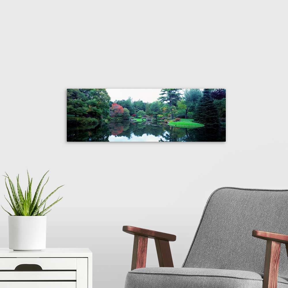 A modern room featuring Panoramic photograph of the vibrant Asticou Azalea Garden reflecting in the water of a large pond...