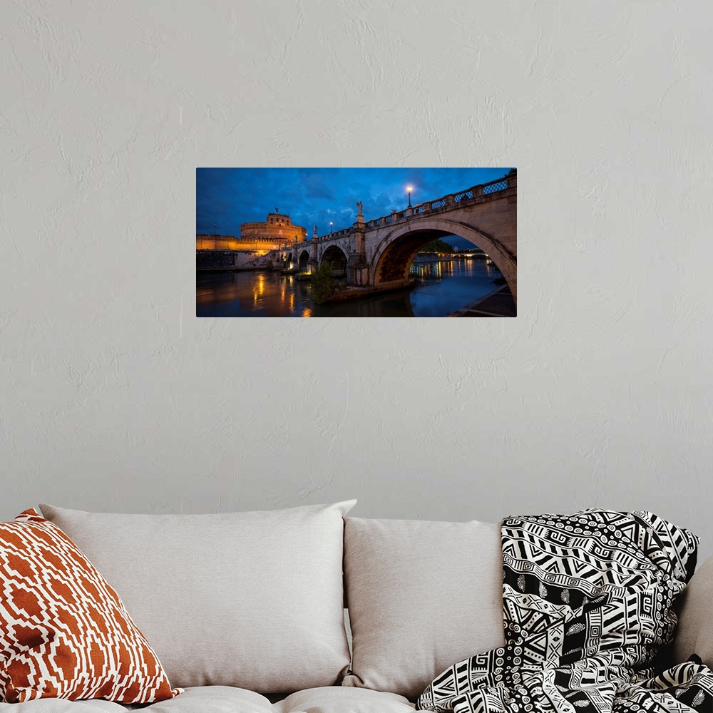 A bohemian room featuring Ponte Sant'Angelo over river with Hadrian's Tomb in the background, Rome, Lazio, Italy.