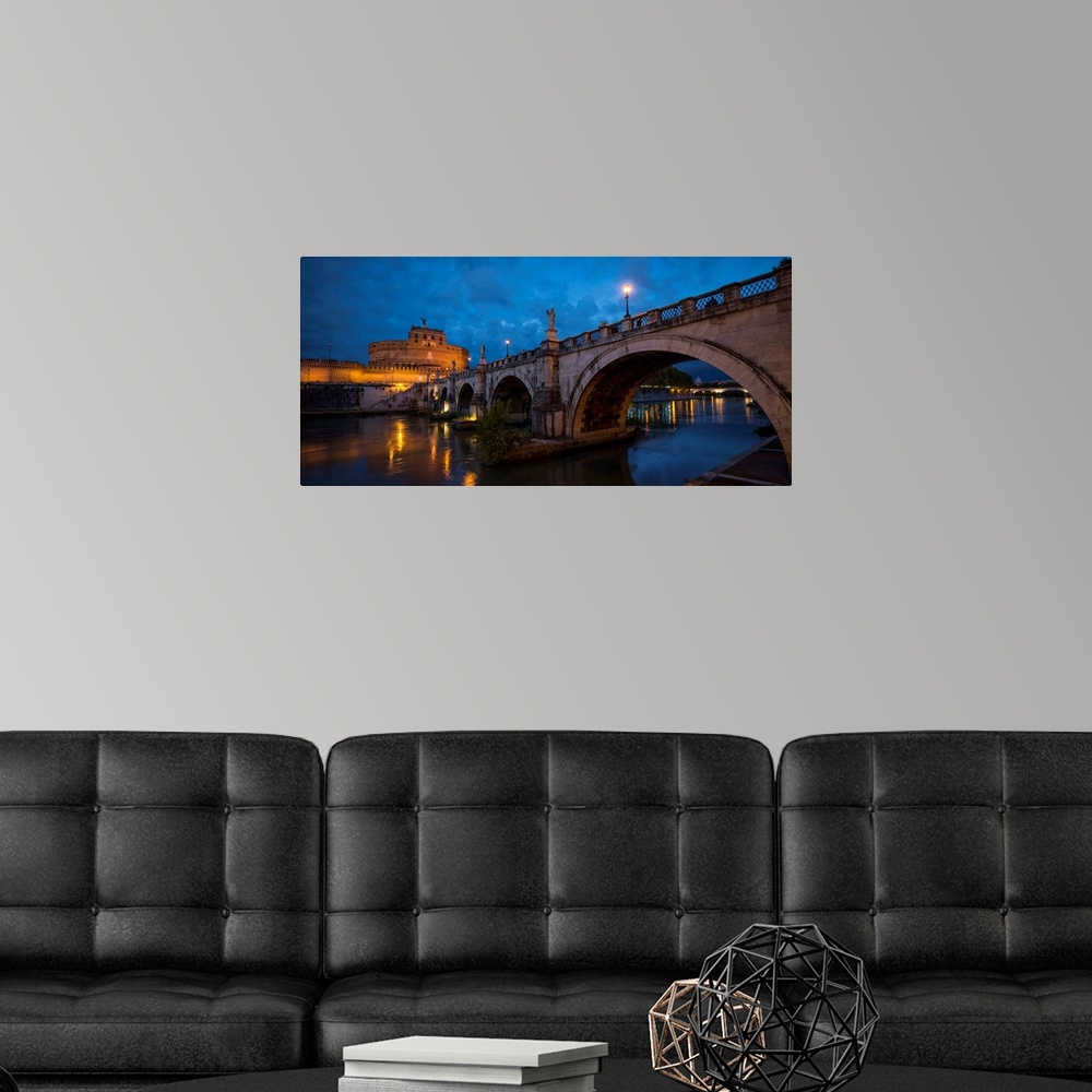 A modern room featuring Ponte Sant'Angelo over river with Hadrian's Tomb in the background, Rome, Lazio, Italy.