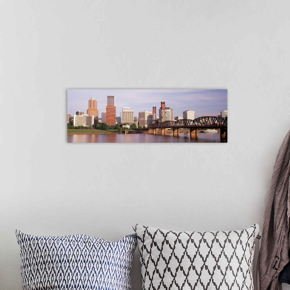 A bohemian room featuring Panoramic photograph of skyline, waterfront, and bridge.
