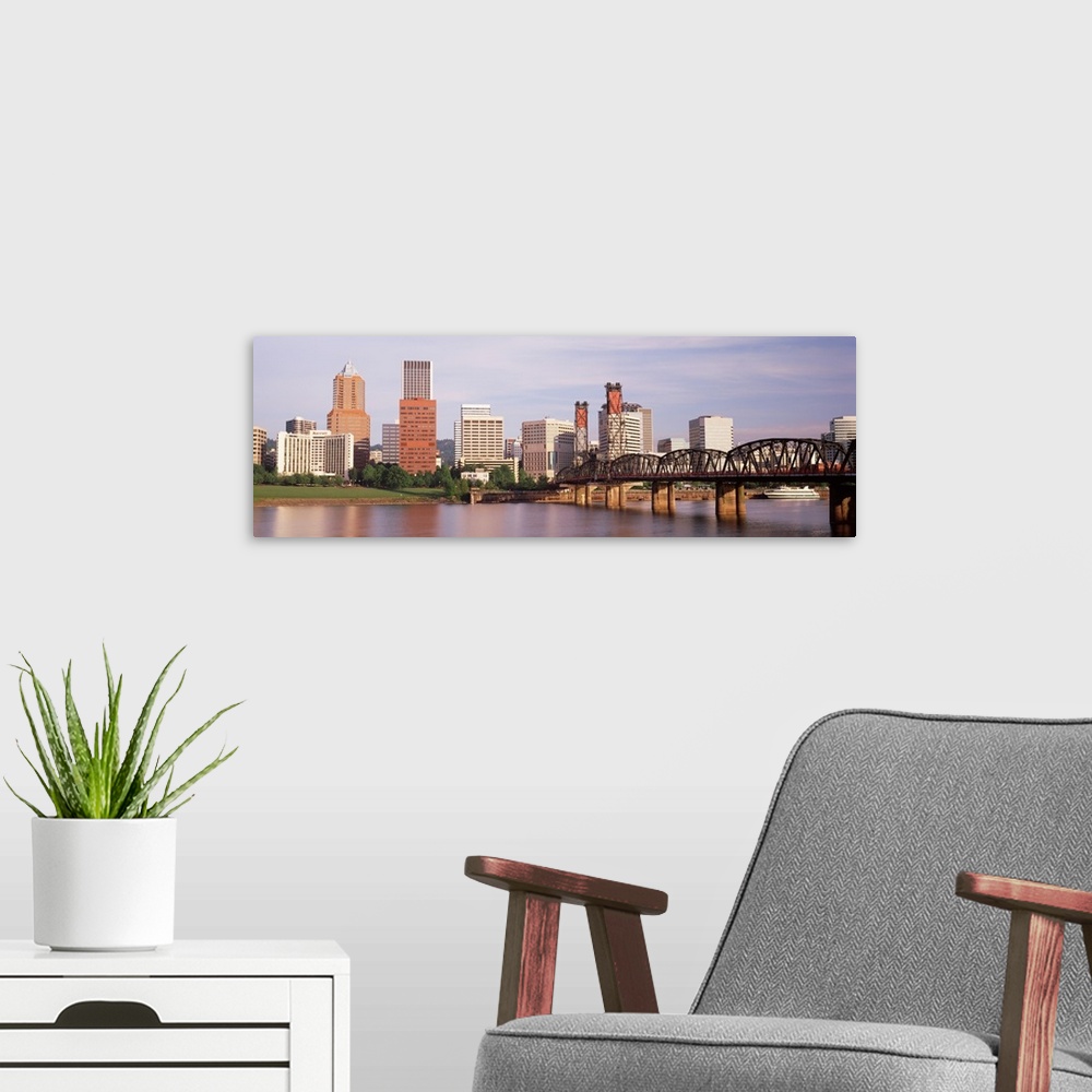 A modern room featuring Panoramic photograph of skyline, waterfront, and bridge.