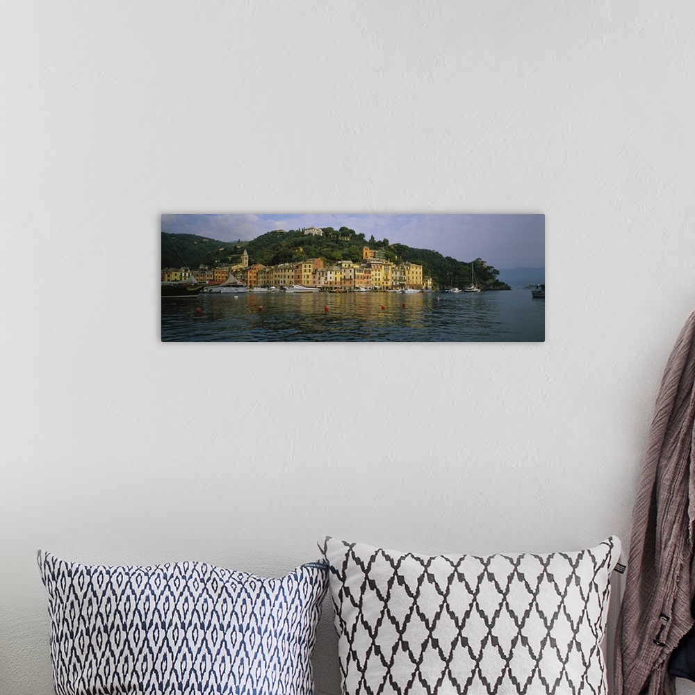 A bohemian room featuring This is a panoramic photograph of the picturesque harbor taken from on the water.