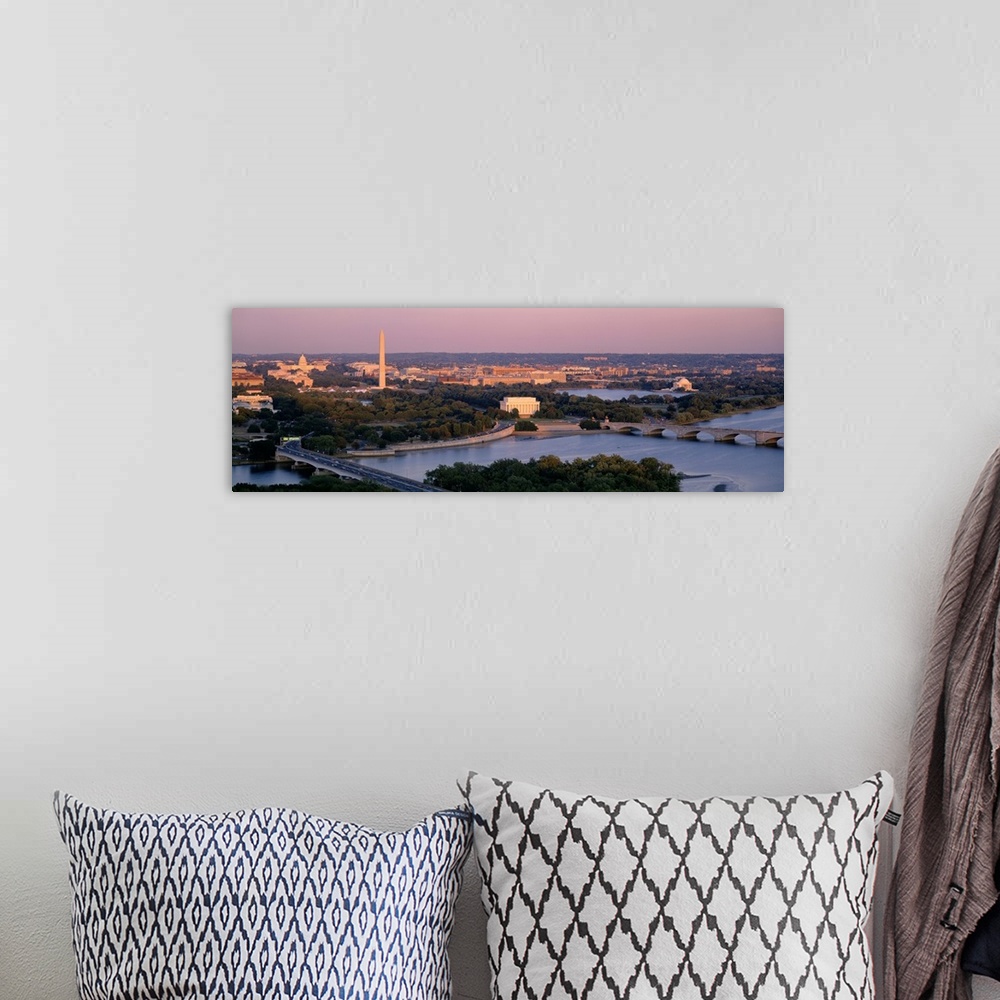 A bohemian room featuring Large panoramic photo art of the major monuments that make up the capitol of the United States at...