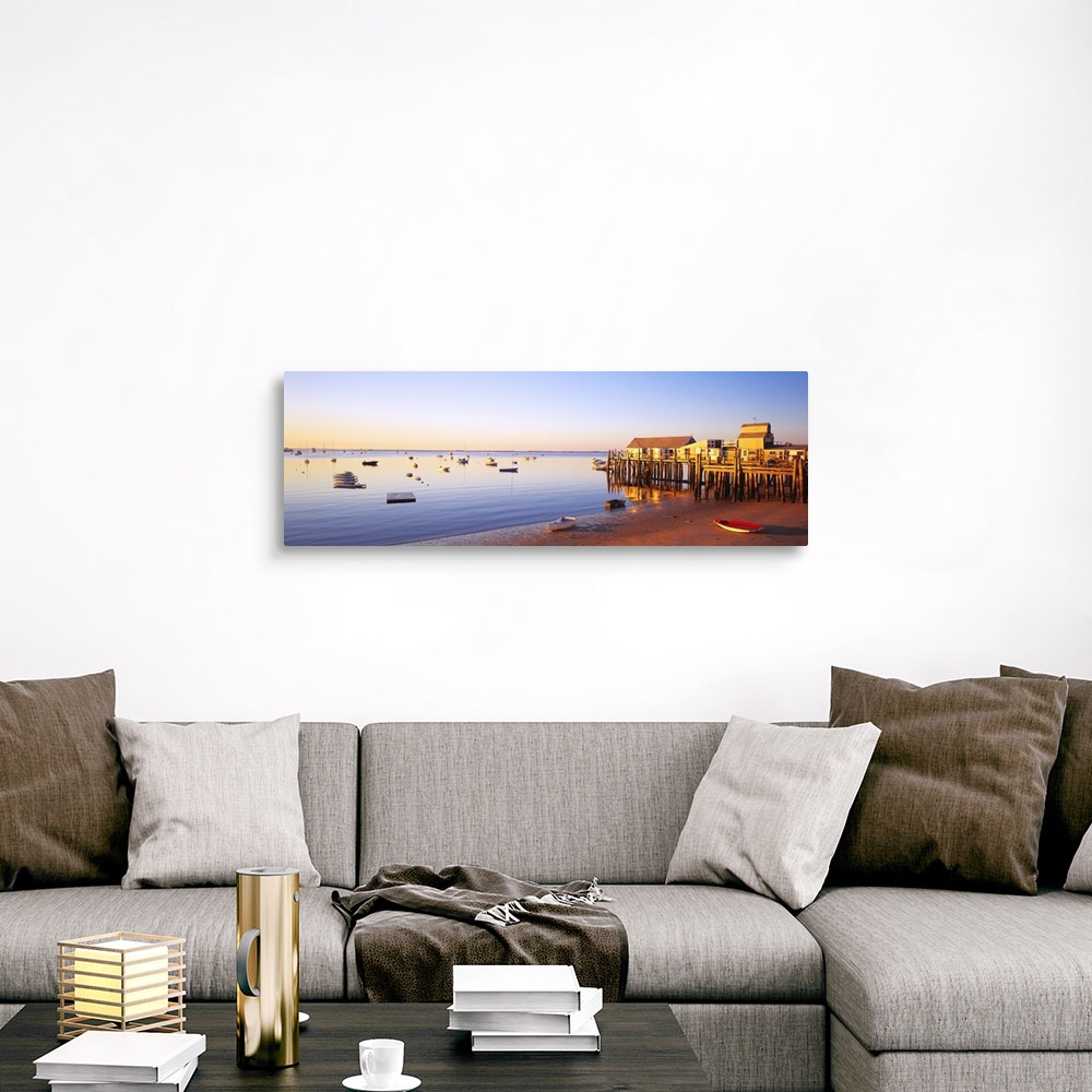 A traditional room featuring Picturesque panoramic photograph of a beach and small pier in Provinetown, Massachusettes. Small ...