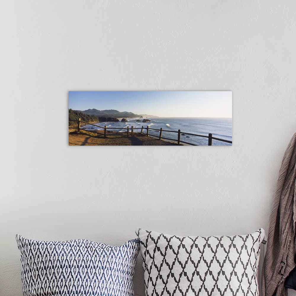 A bohemian room featuring Giant panoramic photograph featuring a railing overlooking Cannon Beach in Oregon (OR) on a sunny...