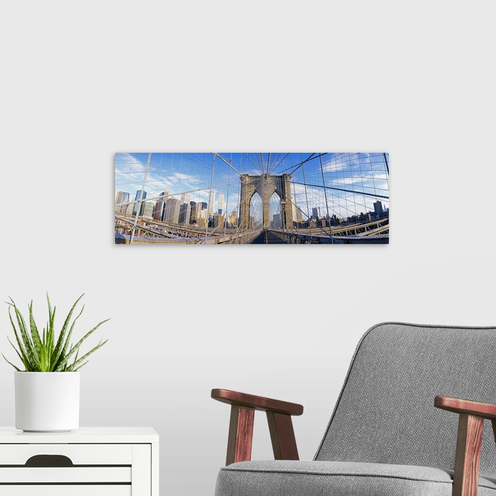 A modern room featuring Panoramic photograph taken from a landmark overpass in New York as it overlooks a busy skyline.  ...