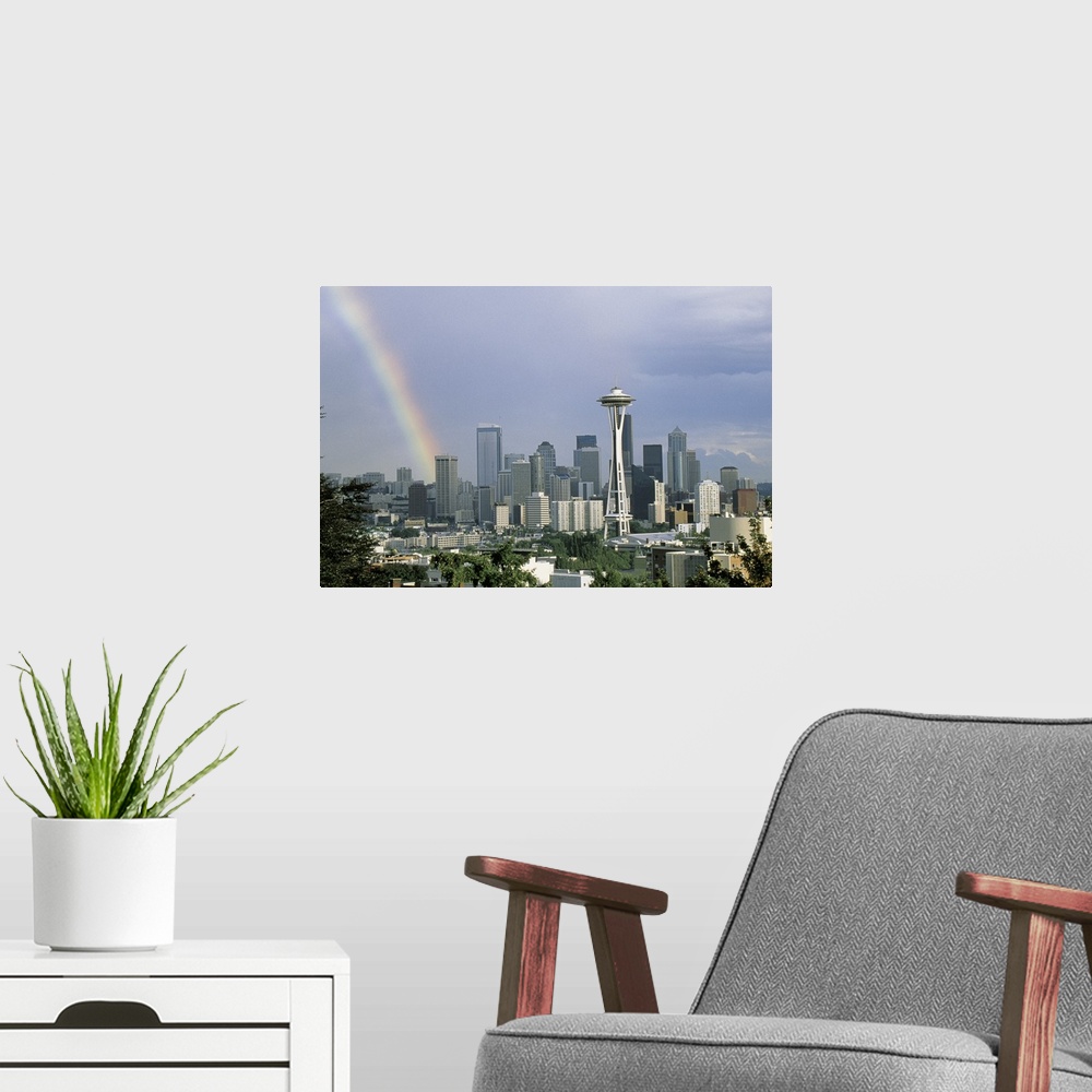 A modern room featuring Photograph of a rainbow above the Seattle city skyline on a cloudy day in Seattle, Washington.