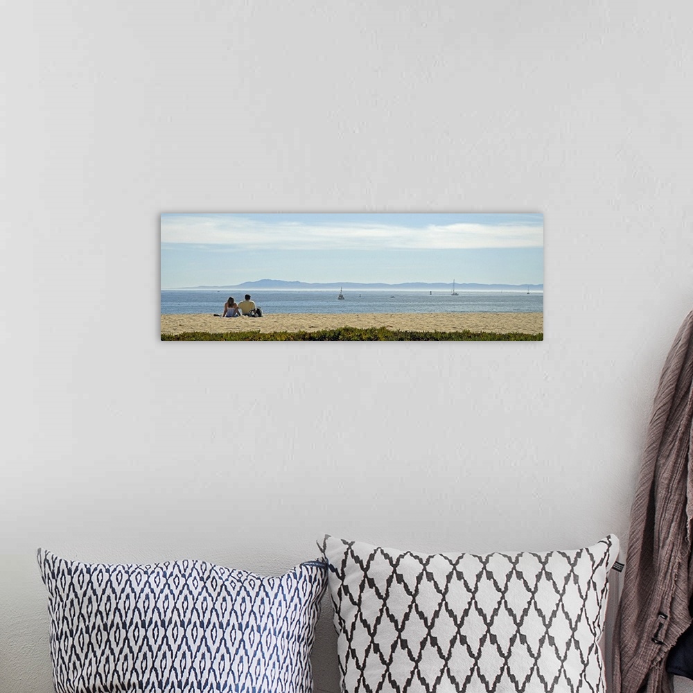 A bohemian room featuring Rear view of a couple sitting on the beach, Channel Islands, Santa Barbara, California