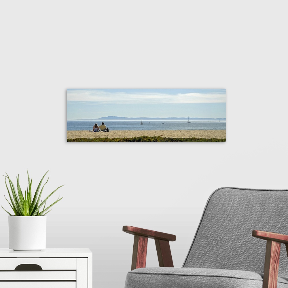 A modern room featuring Rear view of a couple sitting on the beach, Channel Islands, Santa Barbara, California