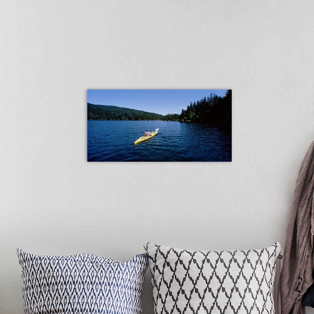 A bohemian room featuring Rear view of a man on a kayak in a lake, Orcas Island, Washington State