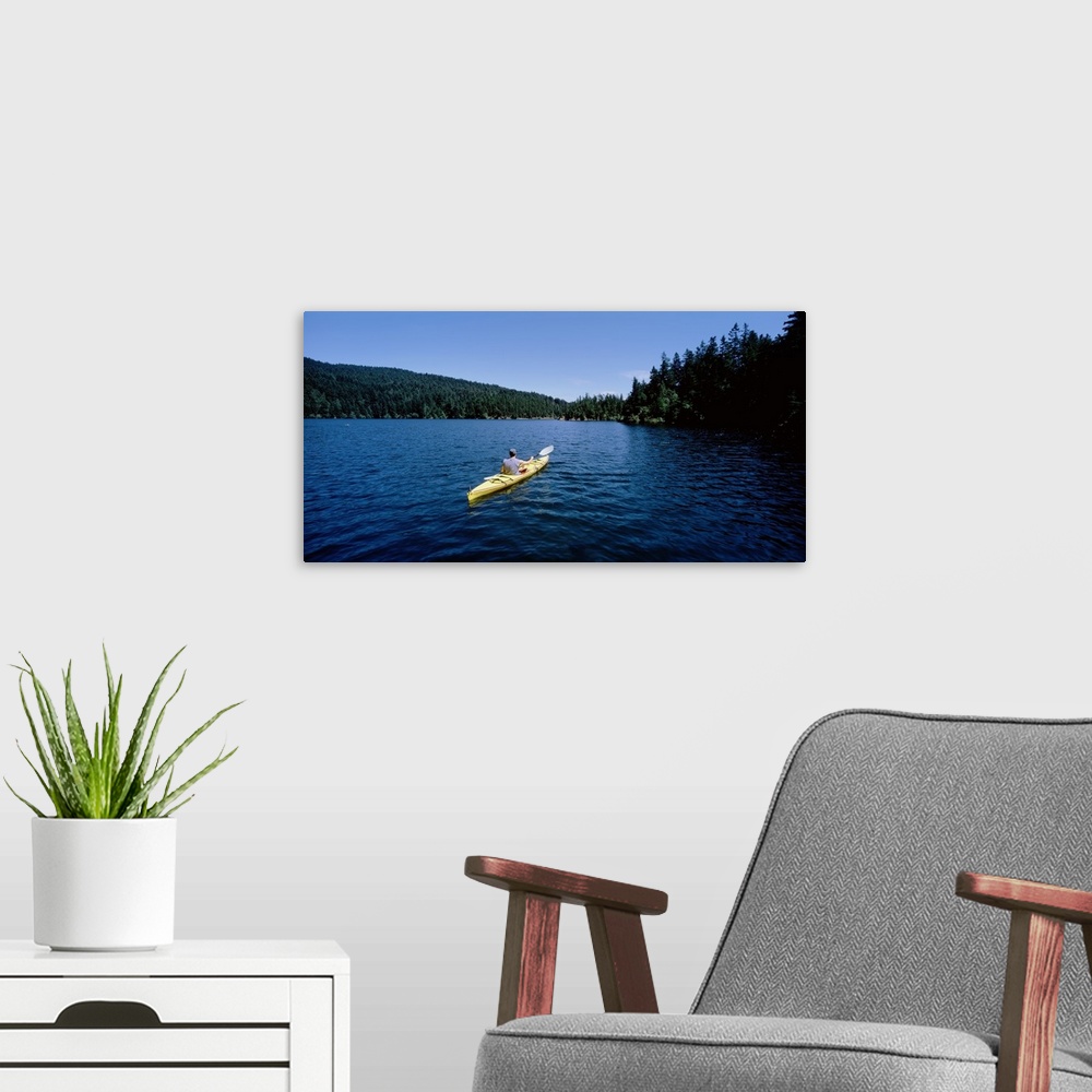 A modern room featuring Rear view of a man on a kayak in a lake, Orcas Island, Washington State
