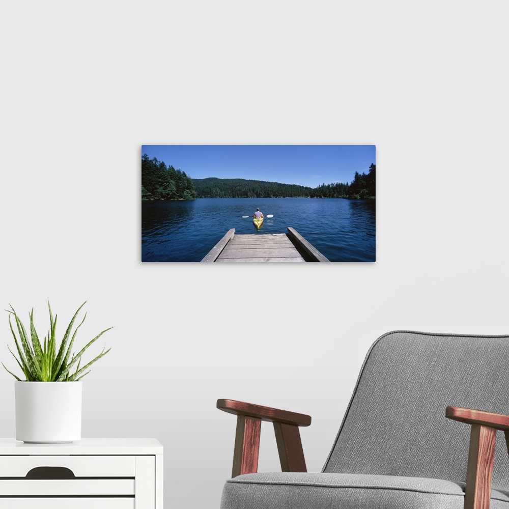 A modern room featuring Rear view of a man on a kayak in a river, Orcas Island, Washington State