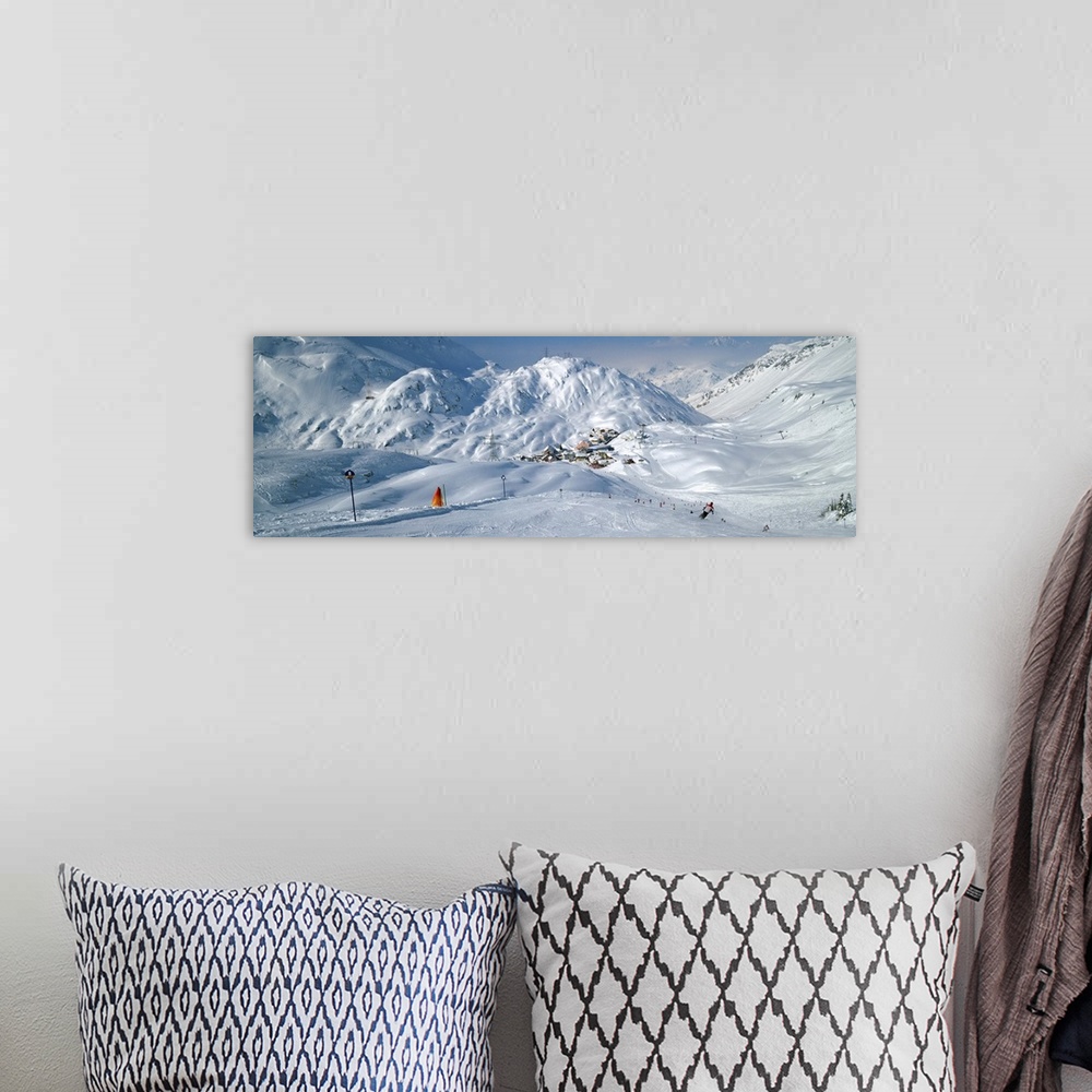 A bohemian room featuring Rear view of a person skiing in snow, St. Christoph, Austria