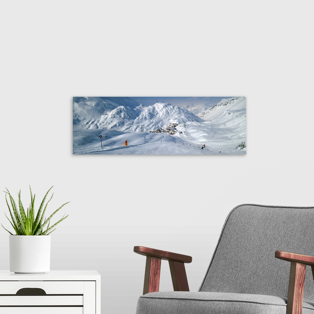 A modern room featuring Rear view of a person skiing in snow, St. Christoph, Austria