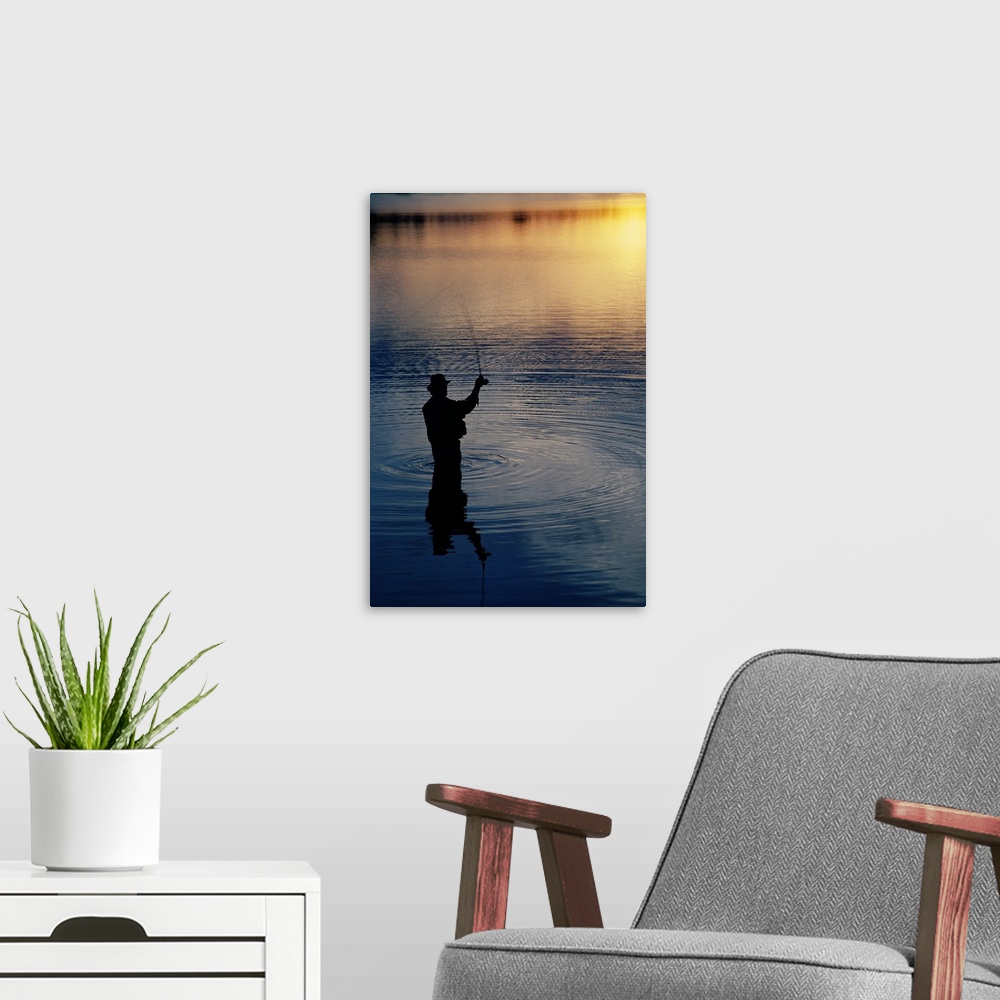 A modern room featuring Rear view of fly-fisherman silhouetted by sunrise, Mauthe Lake, Kettle Moraine State Forest, Wisc...