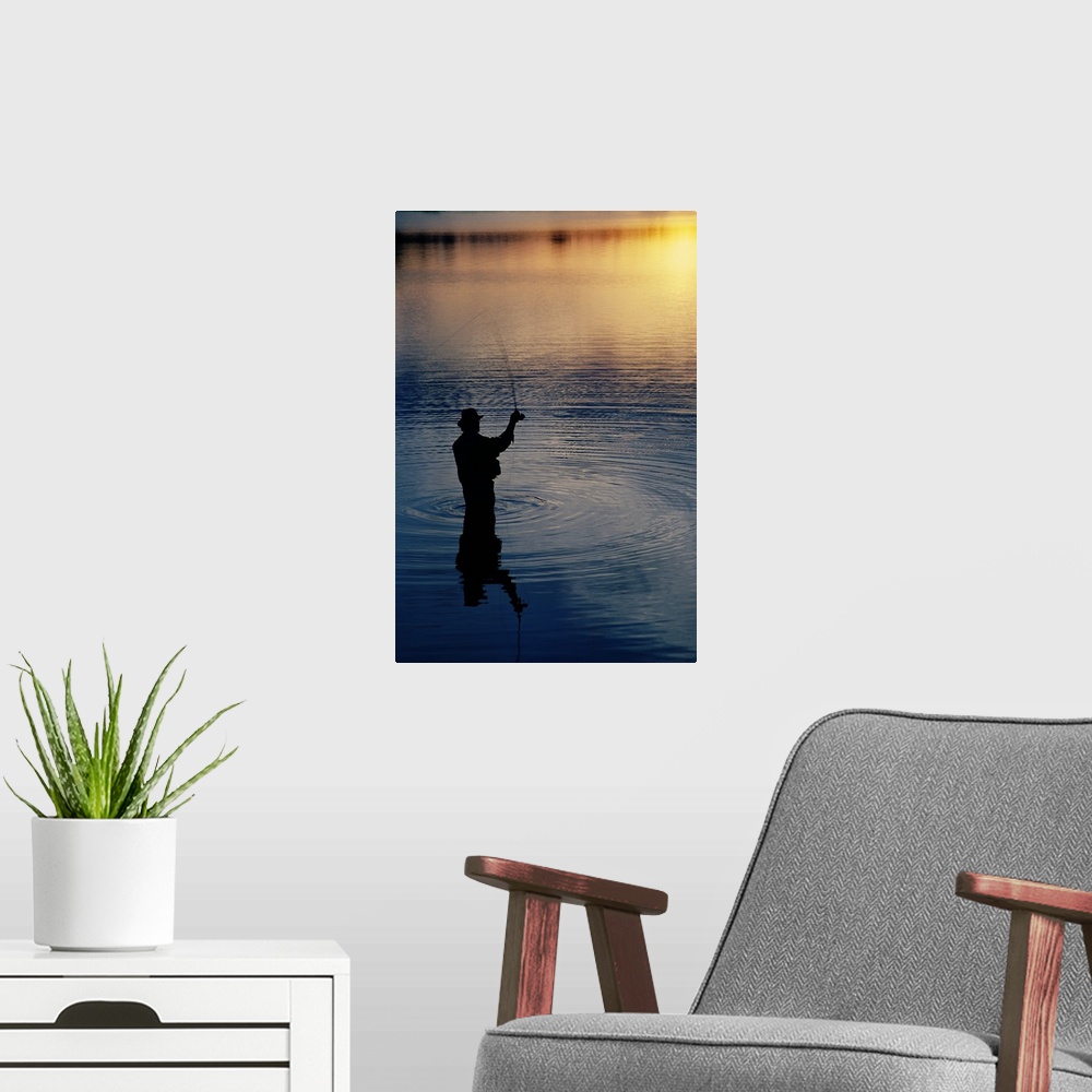 A modern room featuring Rear view of fly-fisherman silhouetted by sunrise, Mauthe Lake, Kettle Moraine State Forest, Wisc...