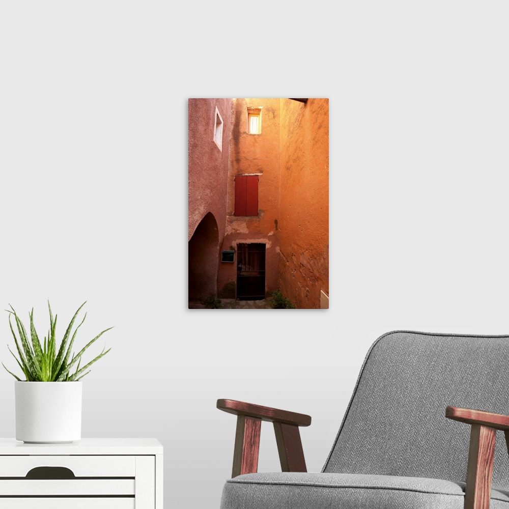 A modern room featuring Red ochre colored building, Roussillon, Vaucluse, Provence-Alpes-Cote d'Azur, France